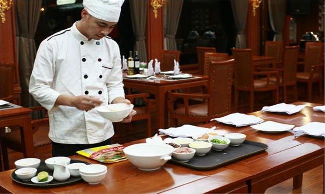 Learning to cook signature Vietnamese dishes on Calypso Cruise